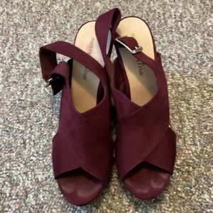 Maroon wedge with silver hardware.
